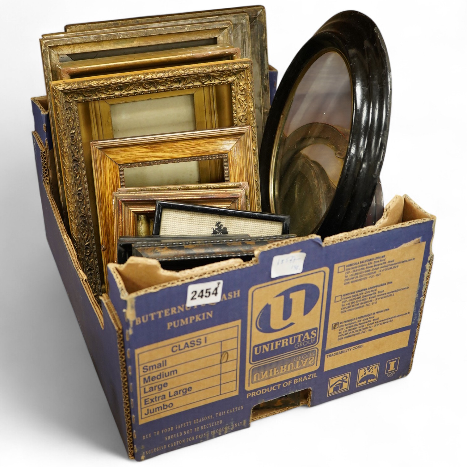 A box of variously-sized rectangular and oval picture frames, largest 29cm high x 24cm wide